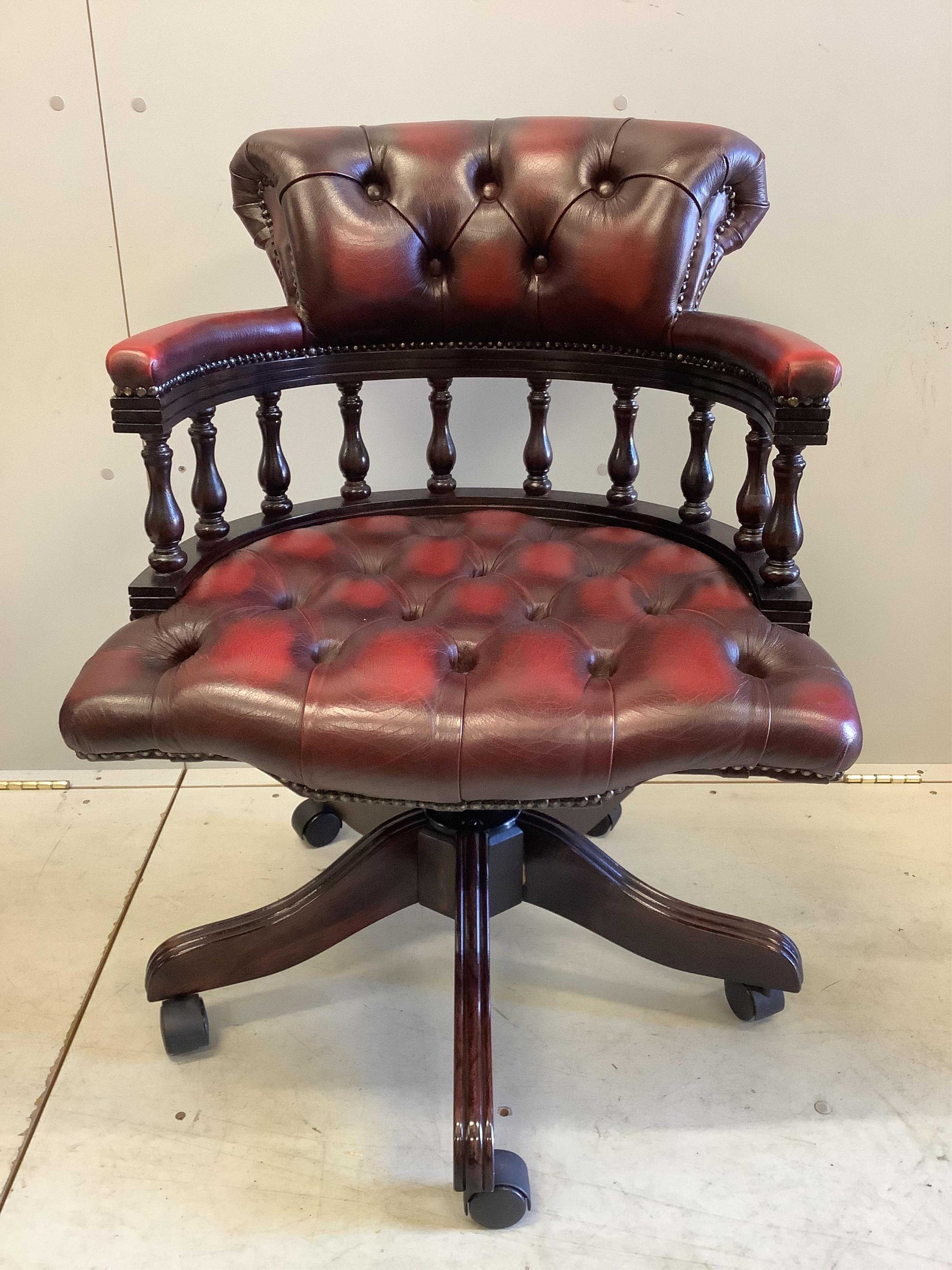 A reproduction Victorian style beech and burgundy leather swivel desk chair, together with a reproduction mahogany pedestal desk, width 121cm, depth 61cm, height 76cm
